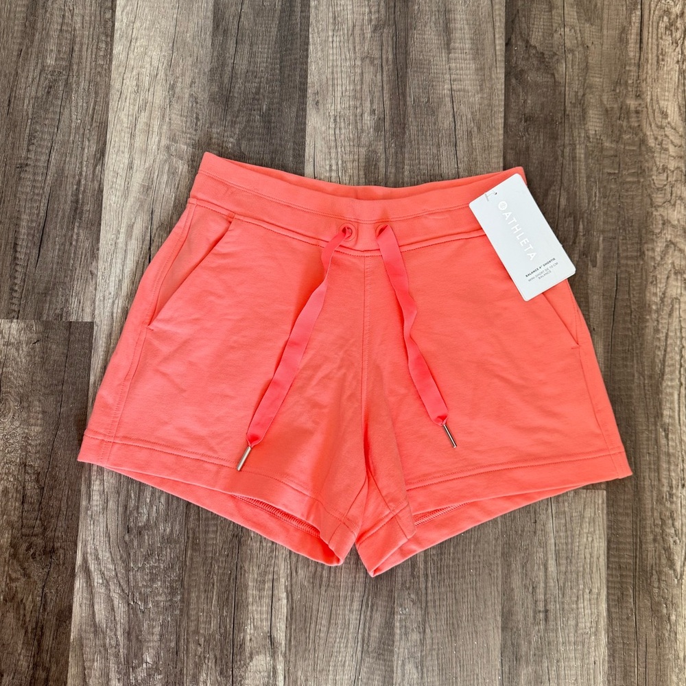 ATHLETA SOFT PERSIMMON ELASTIC WAIST SIDE POCKETS BALANCE 4" size extra small